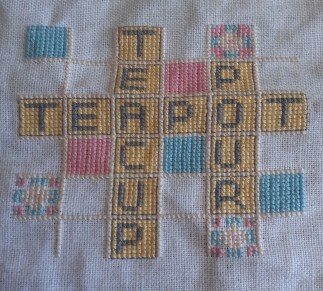 cross-stitch scrabble reading teacup, teapot, pour