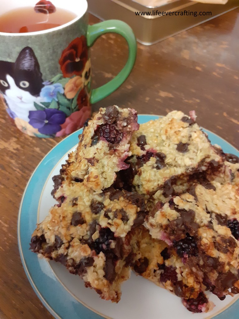 Image shows a plate of flapjack and a cup of tea.