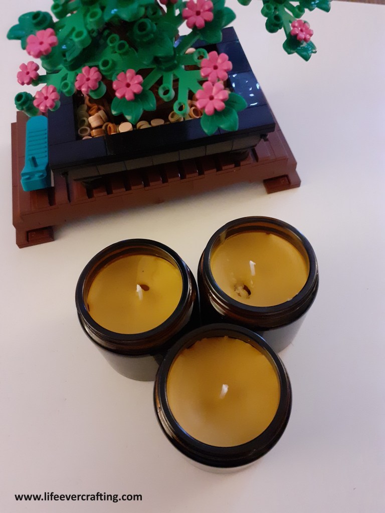 Image shows three beeswax candles.