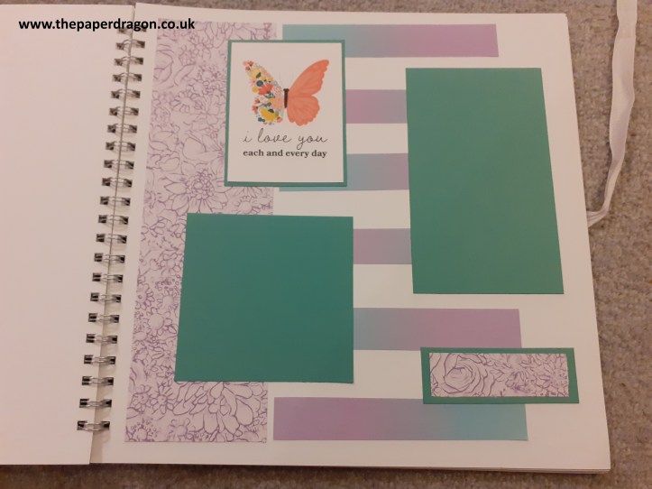 image shows a scrapbook page with purple and green paper.